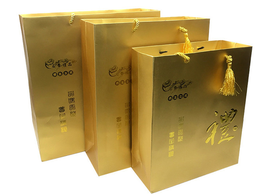 Good price Custom Luxury Printed Gold Paper Gift Bags With Embossed Logo Tassel Handles online